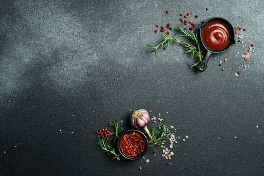 Banner for the menu page. Kitchen table with vegetables, spices and utensils. On a dark background. Top view. Free space for text.