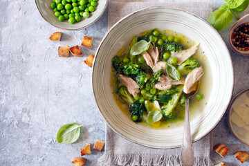 Vegetables soup with chicken on the plate. Top view. Healthy food.
