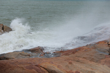 waves crashing on rocks