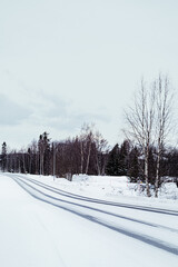 Snow Covered Road Through The Town Of Ivalo, Finland
