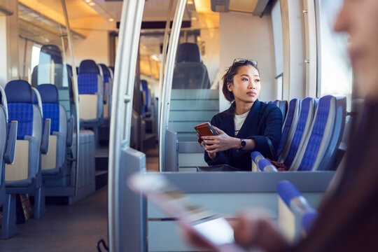 Young woman sitting in train