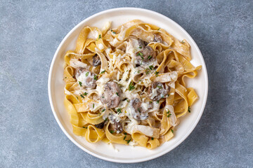 Homemade Italian fettuccine pasta (Fettuccine al Funghi Porcini) with mushroom and cream sauce....