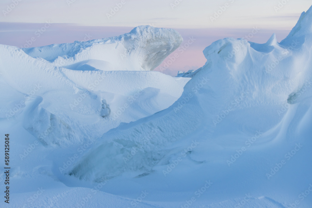 Wall mural winter arctic landscape. view of snow and ice at sunset. ice hummocks on the frozen sea in the arcti