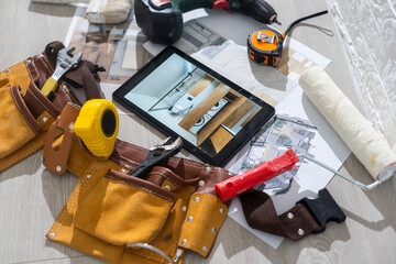 Computer Tablet Showing apartment Illustration Sitting On House Plans. tools