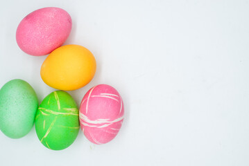 Fototapeta na wymiar Pink, green and yellow Easter eggs isolated white background, Easter concept 