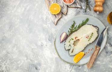 Atlantic wolffish, seawolf or catfish steak on a light background. banner, menu, recipe place for...