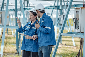 Solar electric installer and practitioner inspect electrical systems for appropriate wiring,...