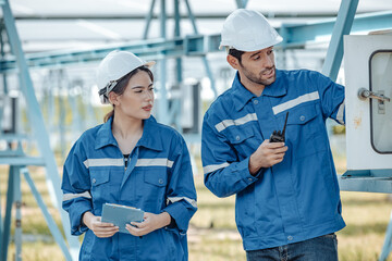 Solar electric installer and practitioner inspect electrical systems for appropriate wiring,...