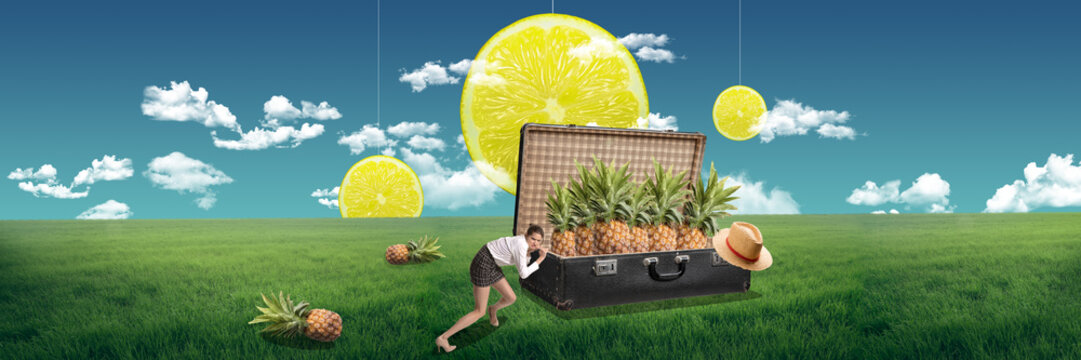 Tropical travel. Young girl pushing retro suitcase with pineapples on green field. Vacation time. Contemporary art collage. Concept of travelling, creativity, surrealism, inspiration - Powered by Adobe