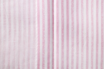 Pink and white striped cotton texture. Fabric textile background