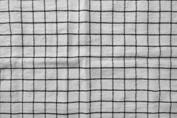 Classic black and white checkered kitchen towel texture. Fabric textile background with visible weave and thread detail. Ideal for web, print, packaging or for any other design project
