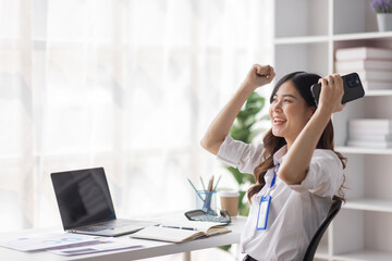 Portrait of success employee businesswoman enjoy success at work desk. Authentic shot joyful woman got jackpot, Surprised and celebrating her victory, happy excited.