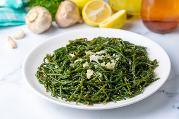 Sea beans and green meze on table. Turkish name; Deniz borulcesi mezesi