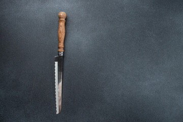 steak knife on dark concrete background. Food cooking background. top view