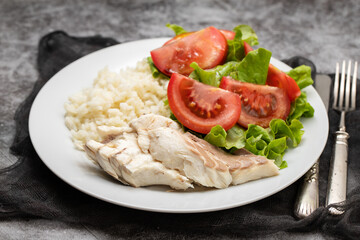 boiled fresh fish with boiled rice and fresh salad