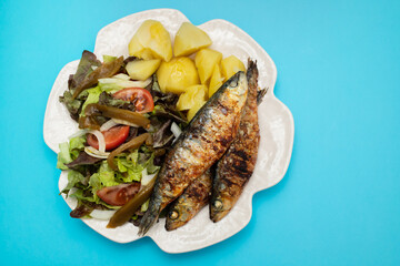 Grilled sardines with boiled potato and fresh salad