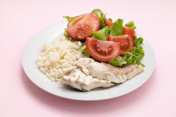 boiled fresh fish with boiled rice and fresh salad