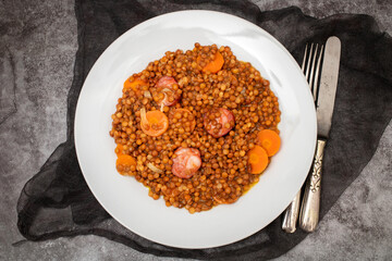 Lentils with chorizo and carrot. Typical Spanish recipe.