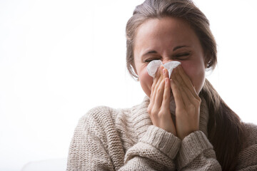Sneezing, coughing woman, brown sweater, sickness, home care, re