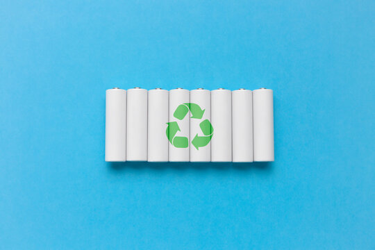 Set of recycling batteries on blue background