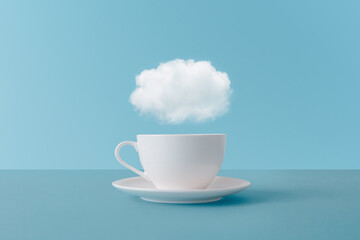 White cloud above ceramic cup of hot drink
