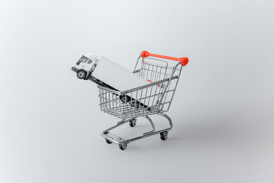 Shopping Trolley With Truck On White Background