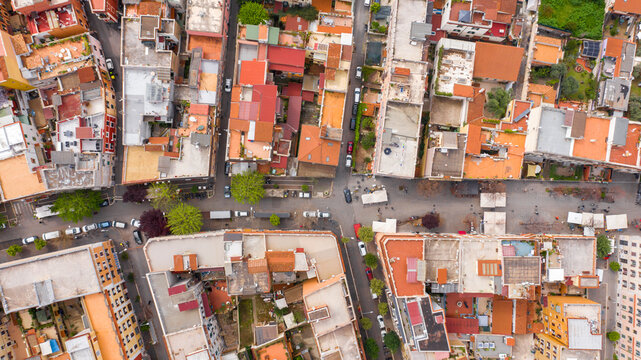 Perpendicular aerial view of the main street of the Pigneto district in Rome, Italy. It is a pedestrian street in a residential area with many buildings.
