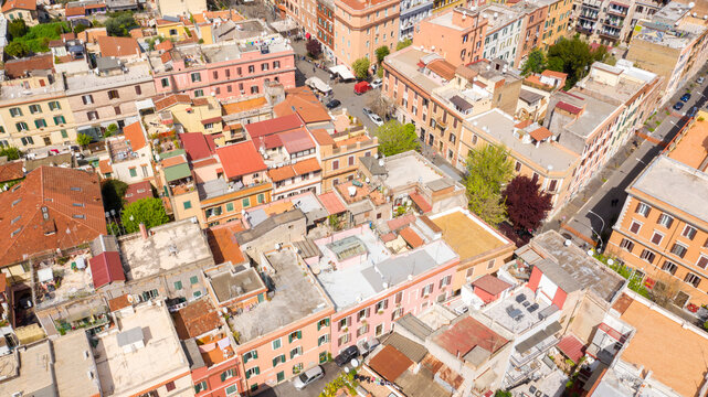 Aerial view of the main street of the Pigneto district in Rome, Italy. It is a pedestrian street in a residential area with many buildings.