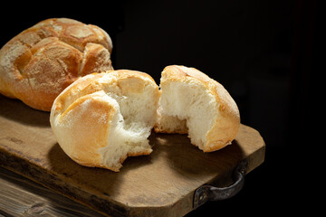 Freshly baked bread on rustic wooden table