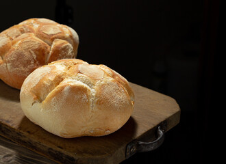 Freshly baked bread on rustic wooden table
