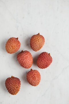 Fresh and ripe lychee fruit on smooth surface
