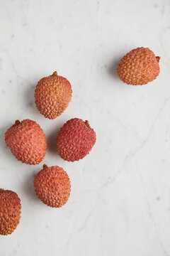 Fresh and ripe lychee fruit on smooth surface