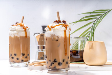 Tapioca boba balls coffee frappe, asian trendy cold coffee drink with tapioca balls and whipped...