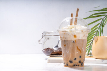Tapioca boba balls coffee frappe, asian trendy cold coffee drink with tapioca balls and whipped...