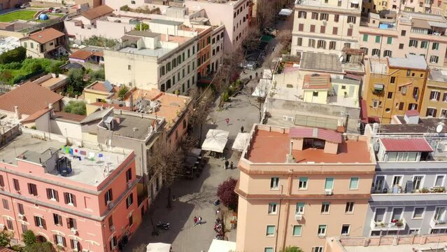 Aerial view of the main street of the Pigneto district in Rome, Italy. It is a pedestrian street in a residential area with many buildings.