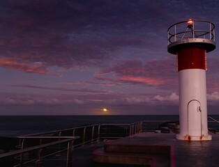Naklejka premium Moonrise, seen from a small lighthouse on the northern tip of the Gold Coast in Queensland,Australia