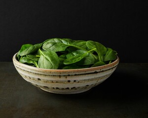 Organic spinach in an artisan bowl