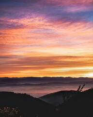 Vertical shot of the hills and mountains at sunset