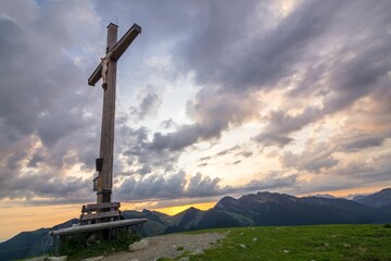 Summit cross with a view and evening sky