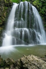 Vertical shot of Josefsthaler Waterfalls. Schliersee, Germany.
