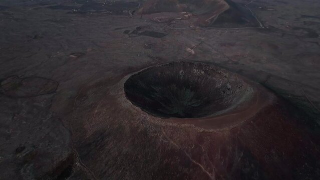 View from above, stunning aerial view of Calderon Hondo during a beautiful sunrise. Calderon Hondo is a volcanic caldera in the sland of Fuerteventura, Canary Islands.