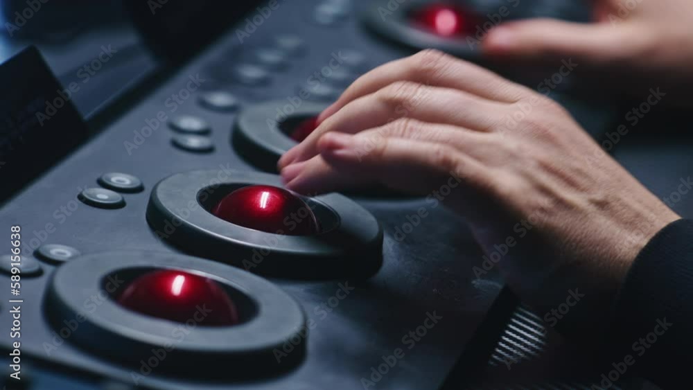 Poster the editor uses digital color grading control panel, presses buttons, changes settings. colorist mak