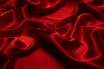 Red silk or satin luxury fabric texture can use as abstract background.