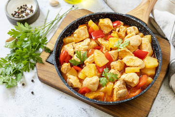 Stir-fried Taiwanese sliced Chicken breast with pineapple and pepper bell. Homemade delicious food in Taiwan on a stone tabletop.