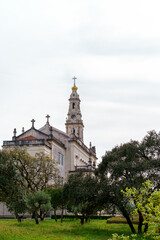 Fototapeta na wymiar cathedral spire and bell tower fatima portugal