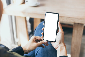 cell phone blank white screen mockup.hand holding texting using mobile on desk at office.background empty space for advertise.work people contact marketing business,technology