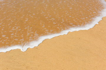 seaside landscape with wave on the sand