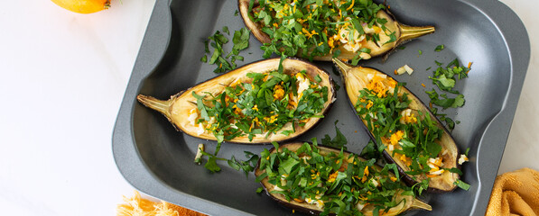baking sheet with baked eggplant on the table