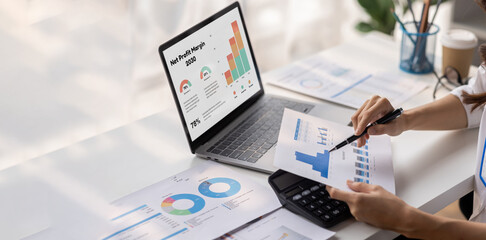 Businesswoman financial expert analyzes business report graph and chart at the office. Concept of...