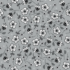 Vector seamless pattern with different beautiful flowers.
